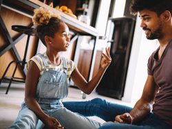 Father and daughter playing on the floor